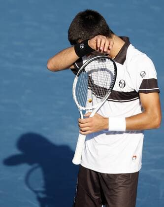 BEIJING, Oct. 5, 2010 - Novak Djokovic of Serbia reacts during his first round match of men s singles at 2010 China Tennis Open Tournament in Beijing, capital of Oct. 5, 2010.