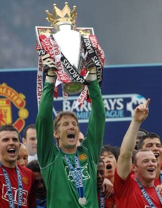 Edwin Van der Sar (ManU goalkeeper) with the trophy - Manchester United wins Premiership league - 
