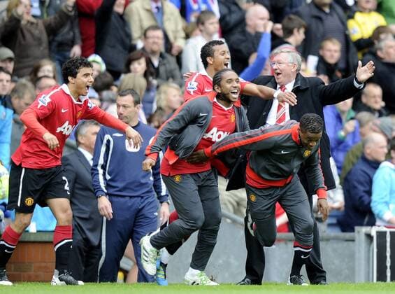 Sir Alex Ferguson coach of Manchester United(R) and players celebrate at the final whistle - Premier League - Manchester United (ManU) - EDITORIAL USE ONLY. No use with unauthorised audio, video, data, fixture lists, club league logos or live services. Online in-match use limited to 120 images, no video emulation. No use in betting, games or single club league player publications.