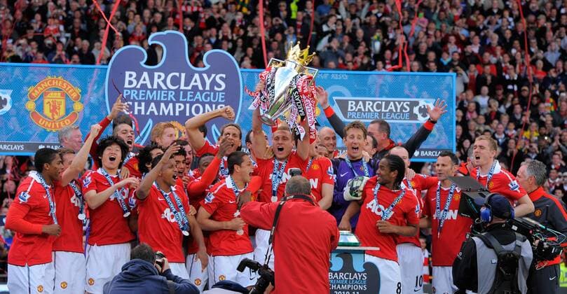 Manchester United players celebrate winning their 19th title - (L-R) Antonio Valencia, Michael Owen, Coch Sir Alex Ferguson, Park Ji Sung, Chris Smalling, Fabio, Nani (front), Ben Amos (back), Rafael, Darron Gibson, Patrice Evra, Rio Ferdinand, Javier Chicharito Hernandez, Dimitar Berbatov, Nemanja Vidic with the Trophy, John O Shea, Edwin van der Saar, Anderson, Wayne Rooney, Ryan Giggs, and Darren Fletcher - Barclays Premier League, Manchester United ManU v FC Blackpool 22nd May, 2011 EDITORIAL USE ONLY. No use with unauthorised audio, video, data, fixture lists, club league logos or live services. Online in-match use limited to 120 images, no video emulation. No use in betting, games or single club league player publications.