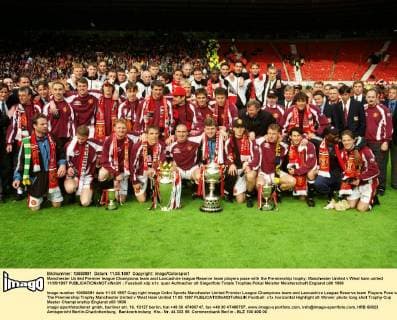Manchester United Premier league Champions team and Lancashire league Reserve team players pose with the Premiership trophy. Manchester United v West ham united 11 05 1997 