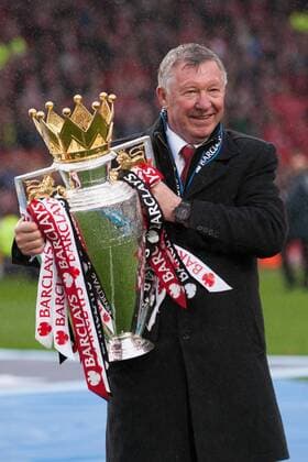 Football - Premier League 2012 2013 - Manchester United - Alex Ferguson, manager of Manchester United celebrates with the trophy at Old Trafford 