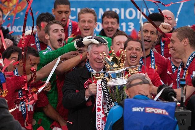 Football - Premier League 2012 2013 - Manchester United - Alex Ferguson, manager of Manchester United leads celebrations with the trophy at Old Trafford 