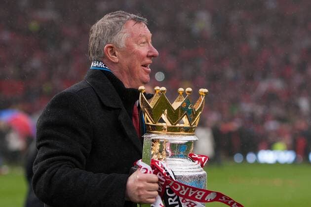 Football - Premier League 2012 2013 - Manchester United ae Alex Ferguson, manager of Manchester United celebrates with the trophy at Old Trafford 