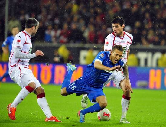 Deutschland - Fussball-Bundesliga - Relegation - 23.052013 Rhein-Neckar-Arena Sinsheim TSG 1899 Hoffenheim (1899) - 1. FC Kaiserslautern (FCK) 3:1 Marc TORREJON (li, FCK) und Florian DICK (FCK) holen Fabian JOHNSON (1899) von den Beinen. Sport