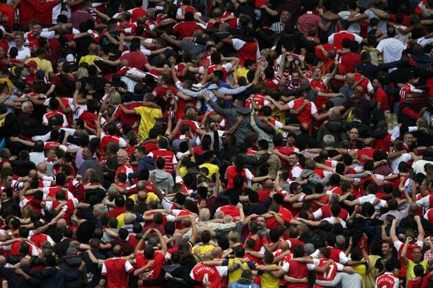 FA Community Shield - Arsenal v Manchester City . . Wembley, Middlesex, UK . . 10.08.2014 Arsenal fans celebrate the third Arsenal goal by doing The Poznan .
