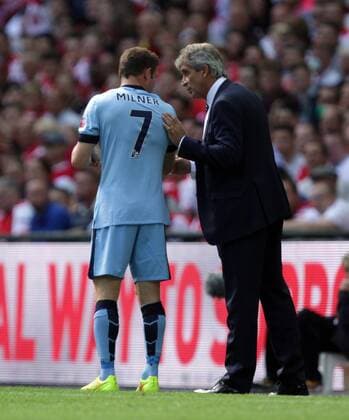 FA Community Shield - Arsenal v Manchester City . . Wembley, Middlesex, UK . . 10.08.2014 James Milner (MC) and Manuel Pellegrini (Man City manager)