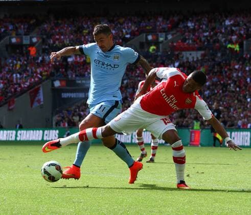 FA Community Shield - Arsenal v Manchester City . . Wembley, Middlesex, UK . . 10.08.2014 Aleksandar Kolorov (MC) Alex Oxlade-Chamberlain (A)