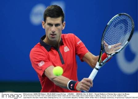 (151008) -- BEIJING, Oct. 8, 2015 -- Novak Djokovic of Serbia hits a return to Zhang Ze of China during their men s singles second round match at the China Open tennis tournament in Beijing, China, Oct. 8, 2015. Djokovic was qualified for the next round after beating Zhang 2-0. ) (SP)CHINA-BEIJING-TENNIS-CHINA OPEN-MEN S SINGLES-DJOKOVIC XingxGuangli