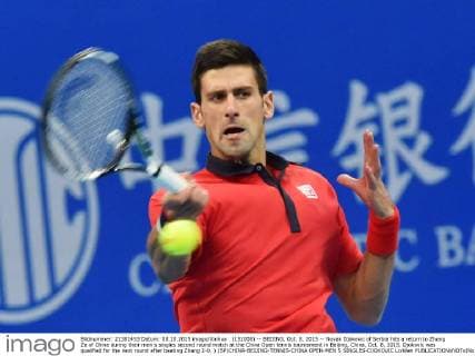 (151008) -- BEIJING, Oct. 8, 2015 -- Novak Djokovic of Serbia hits a return to Zhang Ze of China during their men s singles second round match at the China Open tennis tournament in Beijing, China, Oct. 8, 2015. Djokovic was qualified for the next round after beating Zhang 2-0. ) (SP)CHINA-BEIJING-TENNIS-CHINA OPEN-MEN S SINGLES-DJOKOVIC LixWen