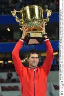 (151011) -- BEIJING, Oct. 11, 2015 -- Novak Djokovic of Serbia poses with his champion trophy during the awarding ceremony for the men s singles final at 2015 China Open Tennis Tournament in Beijing, China, Oct. 11, 2015. Djokovic claimed the title of the event after beating Rafael Nadal of Spain 2-0. ) (SP)CHINA-BEIJING-TENNIS-CHINA OPEN-MEN S SINGLES-FINAL LixWen