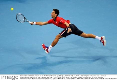 (151011) -- BEIJING, Oct. 11, 2015 -- Novak Djokovic of Serbia hits a return to Rafael Nadal of Spain during their men s singles final at 2015 China Open Tennis Tournament in Beijing, China, Oct. 11, 2015. Djokovic claimed the title of the event after beating Nadal 2-0. ) (SP)CHINA-BEIJING-TENNIS-CHINA OPEN-MEN S SINGLES-FINAL WangxLili