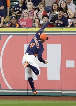 September 25, 2016 - Houston, Texas, U.S. - Houston Astros right fielder GEORGE SPRINGER (4) makes a leaping attempt on a fly ball at the warning track in the first inning during the Major League Baseball game against the Los Angeles Angels at Minute Maid Park. MLB Baseball Herren USA 2016 - Angels vs Astros - ZUMAc04_