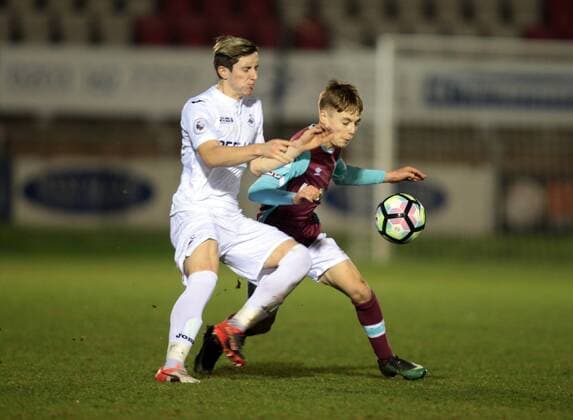 December 12, 2016 - London, United Kingdom - Dan Kemp of West Ham UnitedU23s holds of Aaron Lewis of Swansea City U23s .during Premier League 2 match between West Ham United Under 23s against Swansea CityUnder 23s at Chigwell Construction Stadium Dagenham Britain on 12th Dec 2016. West Ham United U23 v Swansea City U23 - Premier League 2  - ZUMAn230 20161212_zaa_n230_364