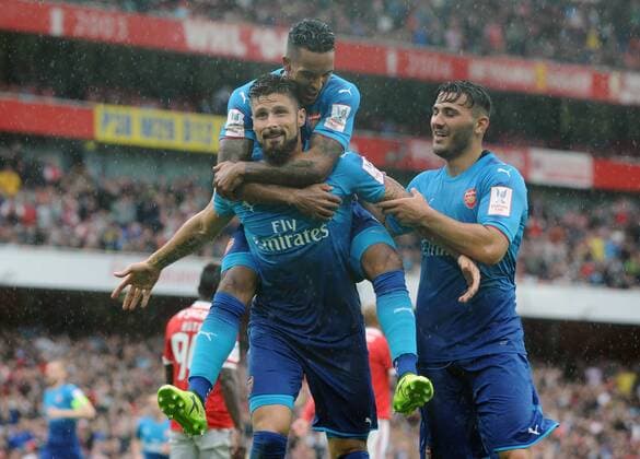Football - 2017 Emirates Cup pre-season friendly competition - Arsenal vs. Benfica Olivier Giroud of Arsenal celebrates his second half goal with Sead Kolasinac and Theo Walcott at The Emirates. COLORSPORT ANDREW COWIE