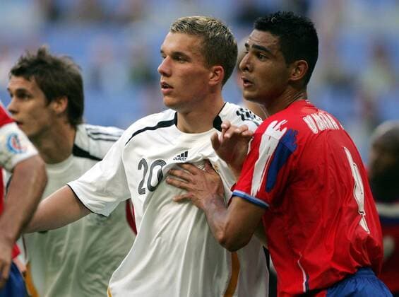 Lukas Podolski is Michael Umana beset action taken during the opening match of the football World Cup 2006 in Munich on 09 06 2006 Munich Germany