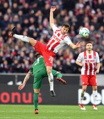 1. FC Cologne FC Augsburg 27 01 2018 s Acharya Cologne flies about Marcel Heller FCA HM