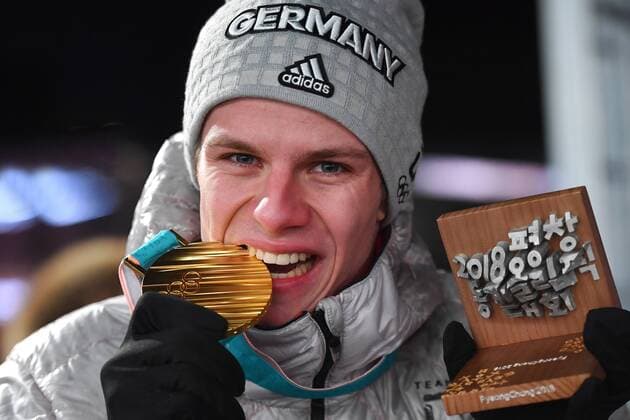 Andreas Walker GER bites his gold medal Olympic medal 1 square gold medalist gold gold medal Olympic champion Olympic medals Plaza on 11 02 2018 ski jumping normal Hill men ski jumping normal Hill at the Winter Olympics 2018 from 09 02 25 02 2018 in PyeongChang of South Korea