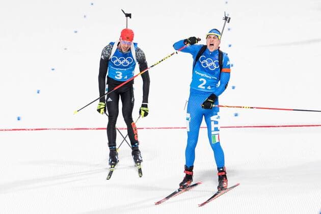180220 Arnd Peiffer of Germany and Dominik Windisch of Italy at the finish line after the Biathlon Mixed Relay during day eleven of the 2018 Winter Olympics on February 20 2018 in Pyeongchang Photo Carl Sandin BILDBYRAN code CS 57999 309  Copyright: CARLxSANDIN BB180220CS107