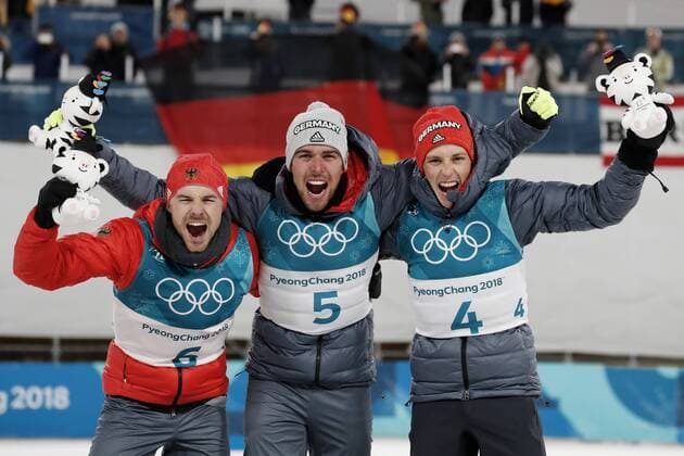 Johannes RYDZEK Olympic champion No. 5 team GER cheers with Eric FRENZEL and RIESSLE Fabian at the victory ceremony Nordic combined 10 km Olympic Winter Games 2018 PyeongChang South Korea Winter Olympics 2018 PyeongChang 20 February 2018
