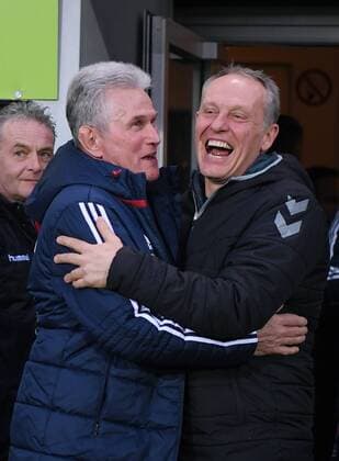 Soccer 1 Bundesliga Season 2017 2018 25 Round SC Freiburg Muenchen 04 03 2018 Coach Christian Streich re SC Freiburg embraces coach Jupp Heynckes left FC Bayern Muenchen Freiburg