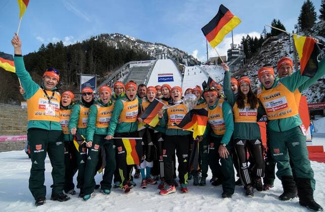 GER FIS Ski Jumping World Cup Ladies 25 03 2018 Audi Arena Oberstdorf GER FIS Ski Jumping World Cup Ladies pictured German team with Cup of the Nations Cup in the middle of the picture Katharina Althaus GER 47 with cup and coach Andreas Bauer nordphotoxHafner nph00200