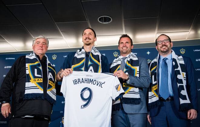 180330 Sigi Schmid Coach Chris Klein Chairman and Dan Beckerman CEO when Zlatan Ibrahimovic presented at a press conference with MLS team LA Galaxy on March 30, 2018 in Los Angeles  Copyright: JOELxMARKLUND BB180330JM068