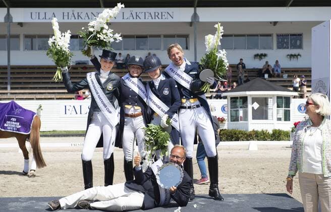 180715 The Swedish team celebrates after winning the FEI Dressage Nations Cup competition during day 8 of Falsterbo Horse Show on July 15, 2018 in Falsterbo Photo Ludvig Thunman BILDBYR N code LT 35504  Copyright: LUDVIGxTHUNMAN BB180715LT023