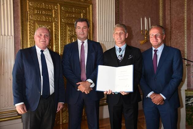 Uli Hoeneß Bavarian Prime Minister Markus Söder Bastian Schweinsteiger and Karl Heinz Rummenigge Award of the Bavarian Order of Merit to Bastian Schweinsteiger Honoring the Order of the State Chancellery Prince Carl Palais Munich 27 August 2018