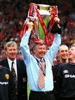 Manager Alex Ferguson Celebrates the Carling Premiership Trophy with Eric Harrison (Youth and Reserves team coach.) Manchester United ManU Carling Premiership Winners 1998 99. Manchester United v Tottenham Hotspur, 17 05 1999. 