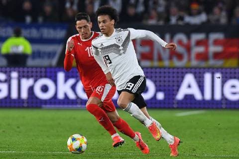 Football international Germany Serbia on 20 03 2019 at the Volkswagen Arena in Wolfsburg Leroy Sane Germany front Sasa Lukic Serbia back DFB regulations prohibit any use of photographs as image sequences and or quasi video xRx