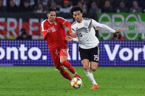 Football international Germany Serbia on 20 03 2019 in the Volkswagen Arena in Wolfsburg Sasa Lukic Serbia left Leroy Sane Germany right DFB regulations prohibit any use of photographs as image sequences and or quasi video xRx