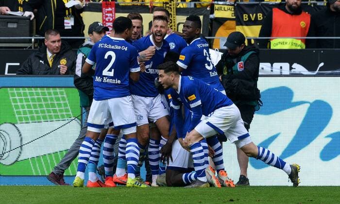 Football Bundesliga Germany Men Men Season 2018 2019 31 Matchday Signal Iduna Park Dortmund Bor Dortmund BVB yellow FC Schalke 04 S04 blue Cheers Schalke after the goal to 1 2 by Salif Sane S04 cheers joy action DFL REGULATIONS PROHIBIT ANY USE OF PHOTOGRAPHS AS IMAGE SEQUENCES AND OR QUASI VIDEO