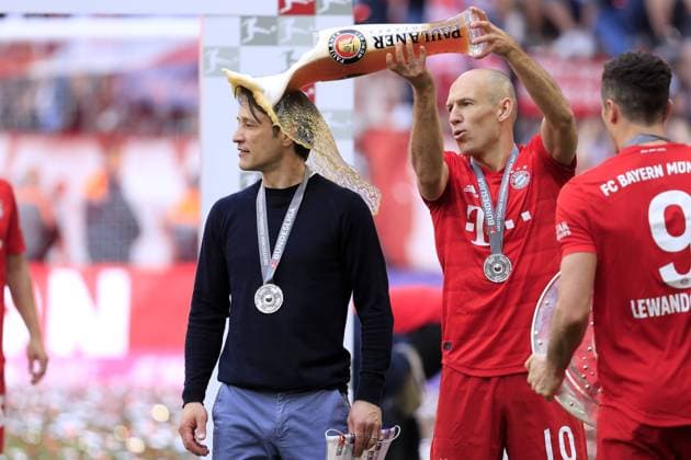 KOVAC Nico Trainer Team FC Bayern Muenchen at the award ceremony German Champion with ROBBEN Arjen and the beer shower DFL Football Bundesliga Season 2018 2019 Last Matchday Bundesliga Season 2018 2019 on 18 May 2019 in the Allianzarena DFL REGULATIONS PROHIBIT ANY USE OF PHOTOGRAPHS as IMAGE SEQUENCES and or QUASI VIDEO