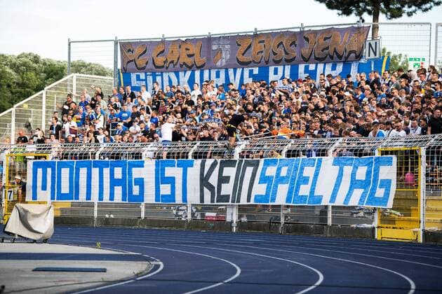 1 Matchday 3 League Season 2019 2020 at 22 7 2019 FC Carl Zeiss Jena vs. FC Ingolstadt 04 The South Curve Jena with a big banner against Monday games Ernst Abbe Sportfeld