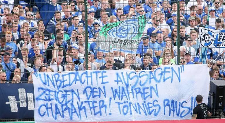 Schalke fans with banner against Tnnies at the match between SV Drochtersen Assel and Schalke 04 , 10 08 2019 DFL REGULATIONS PROHIBIT ANY USE OF PHOTOGRAPHS AS IMAGE SEQUENCES AND OR QUASI VIDEO Photo Sudheimer Eibner Press photo Drochtersen  EP_EER