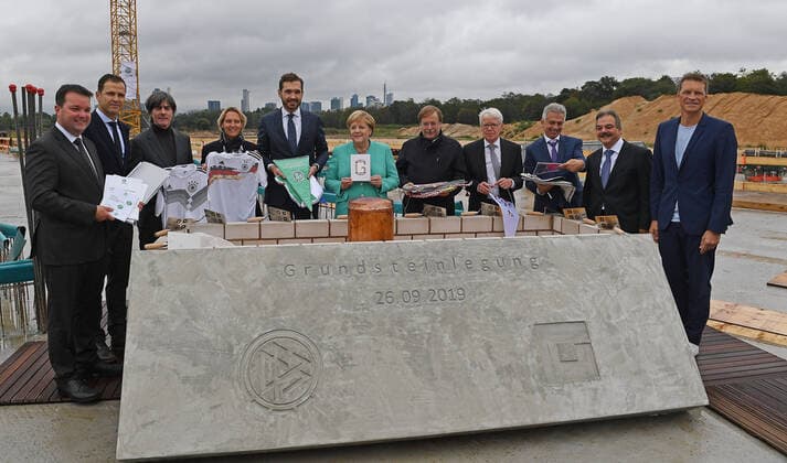 26 09 2019, xjhx, Soccer DFB Academy, laying of the foundation stone of the new DFB headquarters and academy in Frankfurt am Main emspor, v l Peter Matheo Bauunternehmen ,, Team Manager Oliver Bierhoff Deutsche Fussball Nationalmannschaft DFB , laying of the foundation stone of coach Joachim JOGI Loew Deutsche Fussball Nationalmannschaft DFB , coach Martina Voss Tecklenburg Deutsche Fussball Nationalmanschaft Damen , Dr Friedrich Curtius Generalsekräter, German Football Association , Federal Chancellor Angela Merkel, Vice President Dr Rainer Koch German Football Association DFB, Amateurs, Law and Statutes , Dr Reinhard Rauball President League Association DFL , Lord Mayor of the City of Frankfurt Peter Feldmann SPD , Gerhard Wittfeld Architect DFL DFB REGULATIONS PROHIBIT ANY USE OF PHOTOGRAPHS as IMAGE SEQUENCES and or QUASI VIDEO Frankfurt am Main
