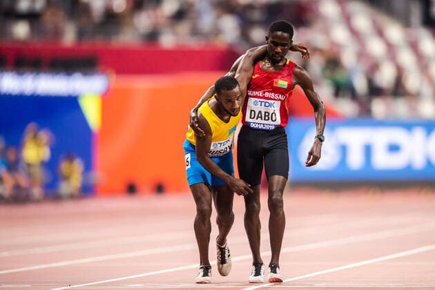 190927 Braima Suncar Daibo helps Jonathan Busby during the men?s 5000 meter qualification during day 1 of the IAAF World Athletics Championships on September 27, 2019 in Doha Photo Joel Marklund BILDBYRAN kod JM 88031 bbeng athletics track field friidrott friidrett iaaf world athletics championships athletics world championship vm friidrotts vm friidretts vm,  Copyright: JOELxMARKLUND BB190927JM150