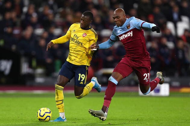 December 9, 2019, London, United Kingdom: Nicolas Pepe of Arsenal and Angelo Ogbonna of West Ham United in action during the Premier League match between West Ham United and Arsenal FC at London Stadium. West Ham United vs Arsenal FC in London, UK - 09 Dec 2019 - ZUMAs197 20191209_zab_s197_023 Copyright: xRichardxCalverx