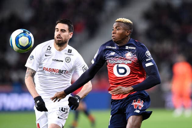 Victor Osimhen ( 7 - LOSC ) - Damien Le Tallec ( 14 - Montpellier ) - n FOOTBALL : Lille OSC vs Montpellier HSC - Ligue 1 - Lille - 13 12 2019 FedericoPestellini Panoramic 