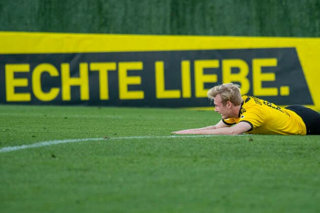 Soccer test matches, BVB Winter Training Camp 2020, Borussia Dortmund FSV Mainz 05 on 11 01 2020 at the Marbella Football Center in Marbella Spain Dortmunds Julian Brandt lies flat on his stomach in front of an advertising tape with the inscription Echte Liebe DFL regulations prohibit any use of photographs as image sequences and or quasi video Copyright: xKirchner-Mediax
