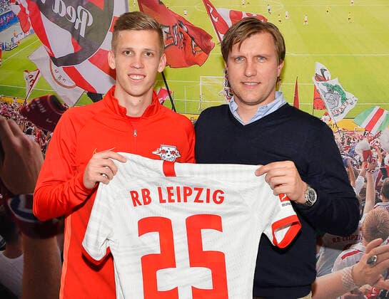 Football Bundesliga 2019 2020, press conference at Bundesliga club RB Leipzig 27 01 2020 Dani Olmo Offensive midfield RB Leipzig, back number 25, 25 left and Markus Kroesche Sports Director RB Leipzig re at the press conference of RB Leipzig 27 01 2020 Both hold the jersey with the back number 25 and the name Olmo in their hands In the background a photo wallpaper with a view into the Red Bull Arena Both look into the camera Leipzig Sachsen Deutschland Red Bull training ground at Cottaweg