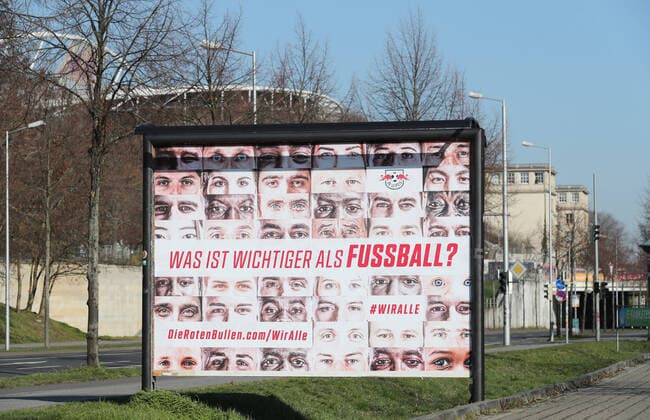 RBL Wir alle Leipzig, 26 03 2020, RB Leipzig Solidarity in the Corona Crisis What is more important than football We all The health of all goes before the campaign of football Bundesliga club RasenBallsport Leipzig , In the picture Wiralle poster In the background the Red Bull Arena ,