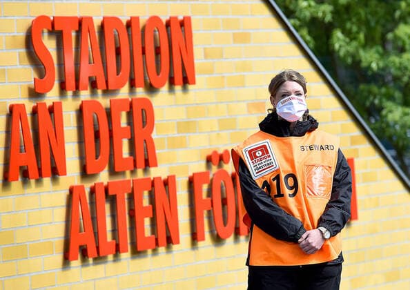 17 05 2020, xlakx, Fussball 1 Bundesliga, Season 19 20, Matchday 26,1 FC Union Berlin FC Bayern Muenchen emspor, v l Steward with protective mask in front of the stadium at the old Foersterei Only for journalistic purposes Only for editorial use DFL DFB REGULATIONS PROHIBIT ANY USE OF PHOTOGRAPHS as IMAGE SEQUENCES and or QUASI VIDEO Koepenick