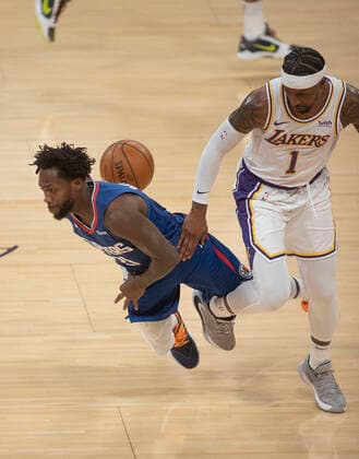 December 13, 2020, Los Angeles, California, USA: Kentavious Caldwell-Pope 1 of the Los Angeles Lakers trips Patrick Beverley 21 of the Los Angeles Clippers during their preseason NBA, Basketball Herren, USA game on Sunday December 13, 2020 at the Staples Center in Los Angeles, California. Lakers defeat Clippers, 131-106. JAVIER ROJAS PI Los Angeles USA - ZUMAp124 20201213_zaa_p124_003 Copyright: xJavierxRojasx