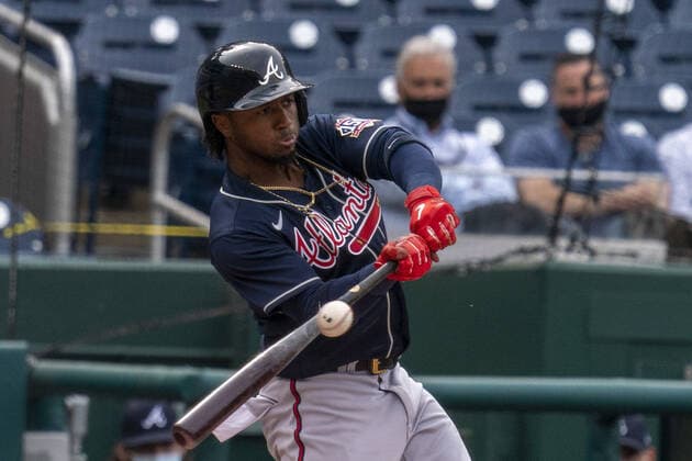 Atlanta Braves second baseman Ozzie Albies makes connect with the ball against the Washington Nationals in the first inning at Nationals Park in Washington, DC on Thursday, May 6 2021.  WAP20210506004 TASOSxKATOPODIS