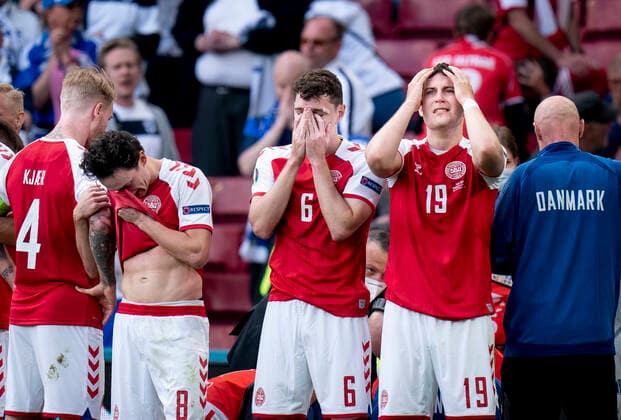 Simon Kjaer, Thomas Delaney, Andreas Christensen and Jonas Wind stand in front of Christian Eriksen during the European Championship international match between Denmark Finland in the Park, Copenhagen Saturday 12 June 2021, Copenhagen Denmark  Copyright: Ritzau Scanpix LiselottexSabroex COP101 spdk20210612-191512-L