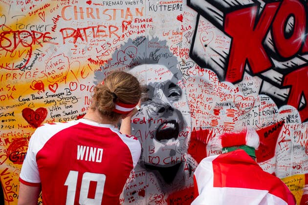 Feature, The Wall ref Eriksen, Graffiti wall with recovery wishes for the collapsed player Christian Eriksen in the center of Copenhagen, a fan writes his wish on the wall, on 21 06 2021 in Copenhagen Denmark European Football Championship 2020 from 11 06 2021 11 07 2021 Â