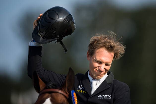 210718 Alexander Zetterman, Sweden cheers on the horse Triton Hästak after winning the Falsterbo Grand Prix during day 9 of the Falsterbo Horse Show on July 18, 2021 in Falsterbo,  Copyright: PETTERxARVIDSON BB210718PA164