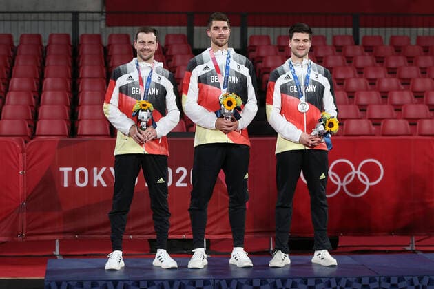 Germany Timo Boll Patrick Franziska, Dimitri Ovtcharov after team gold medal match at 2021 Olympic Games Tokyo2020 in Tokyo 06 08 2021
